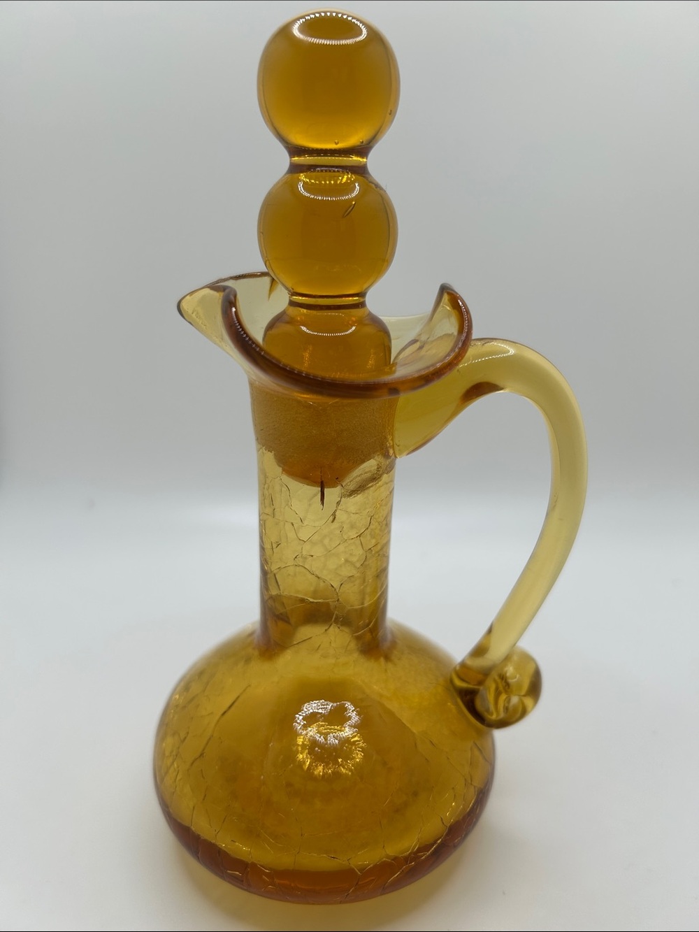 Vintage crackle glass cruet pitcher with 3 ball stopper.